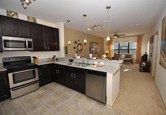 Included photos from the model unit, only differences is the flooring. My apartment has laminate wood flooring in the living room and kitchen.