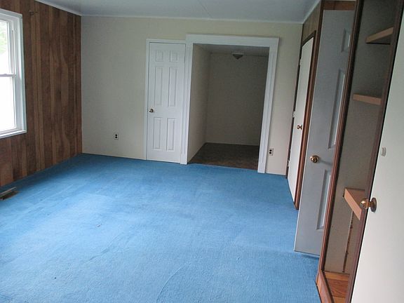 large bedroom with double closet and office