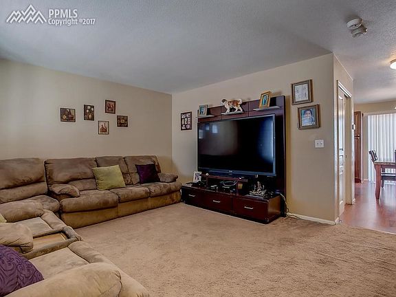 Open Family Room flows into kitchen/dining area.