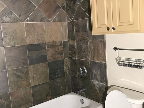 Bathroom storage, slate tile around tub 