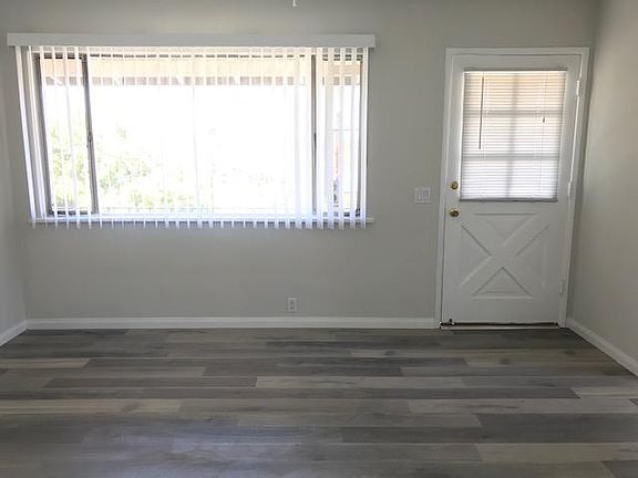 Living Room with view of mountains, New Laminate Flooring, Fresh paint