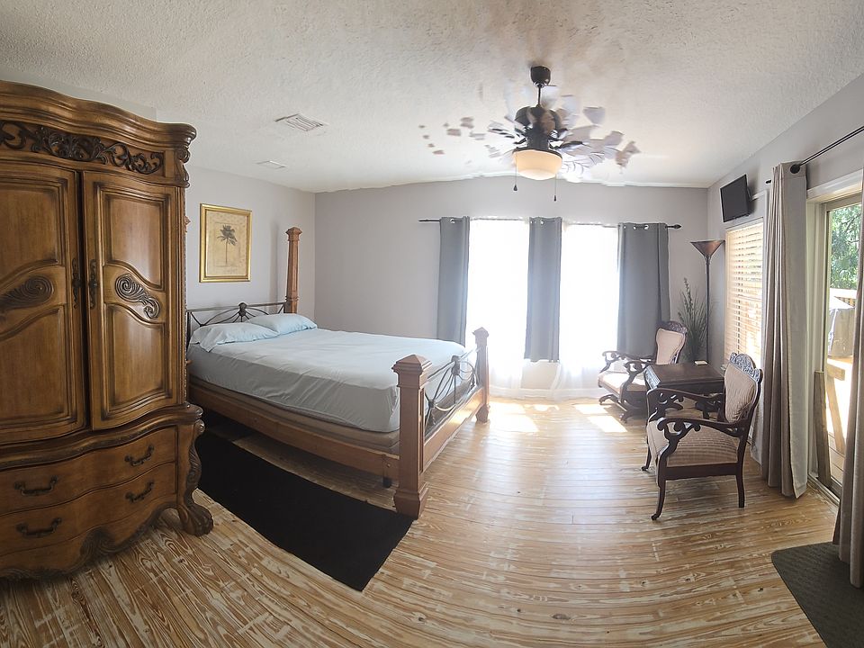 Main area of the suite. This suite on on the back side of the mansion and the sliding glass door is the private entrance. The other side of the suite is generally locked from inside the suite & folks stay to themselves, but you can go inmain kitchen too