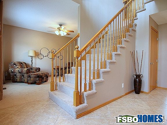 Central Staircase and Adjacent Sitting Room / Formal Dining Room