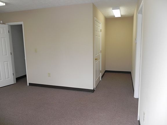 Inside office space with storage closet & bathroom
