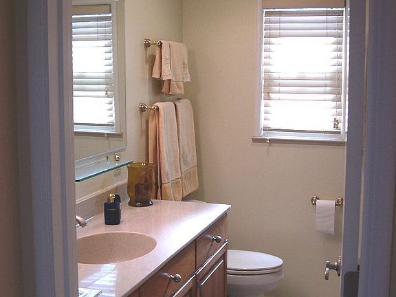 Main bath has tub/shower and built-in linen behind the door.