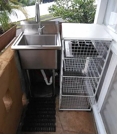 Out door stainless steel sink in the shade.