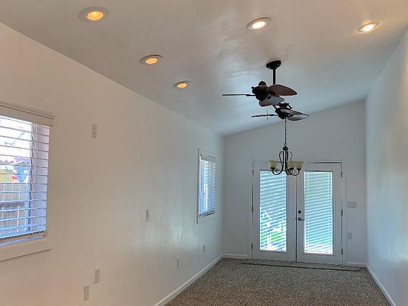 Enclosed patio room, would be great for a pool table
