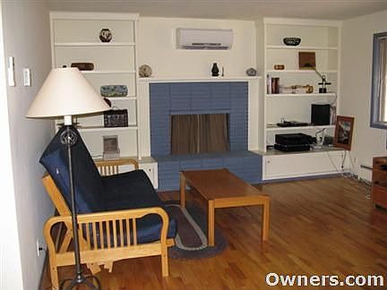 solid oak floors, fireplace, built-in book shelves