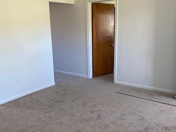 Living room, doorway to bedroom and hallway to bathroom