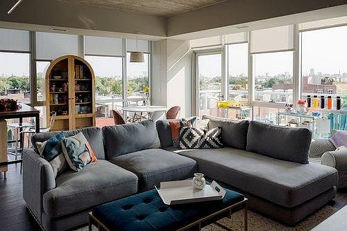 Living/Dining room with floor-to-ceiling windows. Balcony access, overlooks the back terrace and 606 Bloomingdale Trail