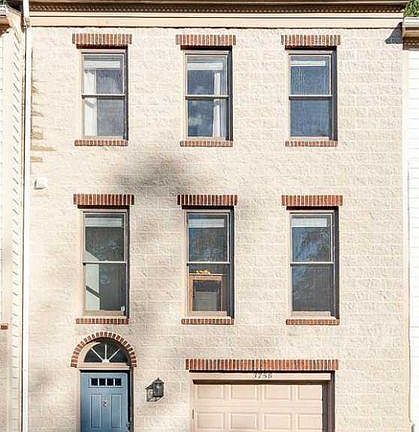 Stone exterior townhome with garage