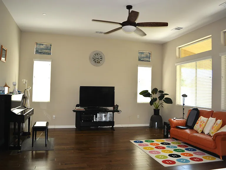 Family room has windows stretch along the back wall for lights and view of the spacious backyard