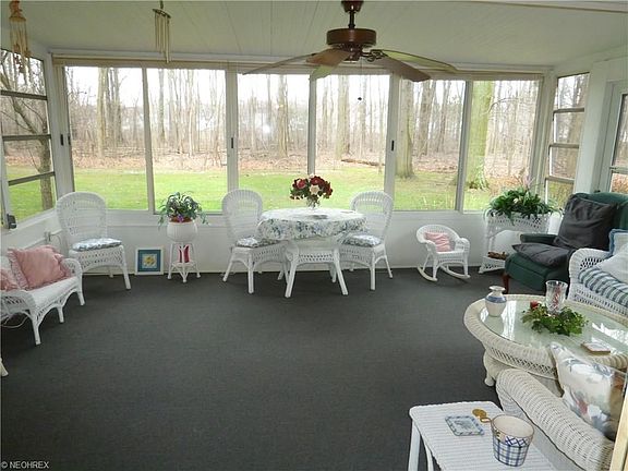 ENJOY SPRING, SUMMER AND FALL IN THIS FABULOUS ENCLOSED PORCH WITH CEILING FAN