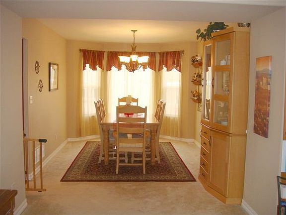Form dining room has a bay window to give you extra space for large gatherings