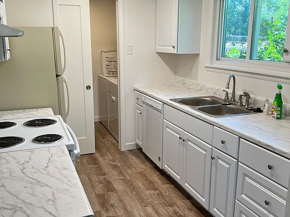 Kitchen and laundry with pocket door.