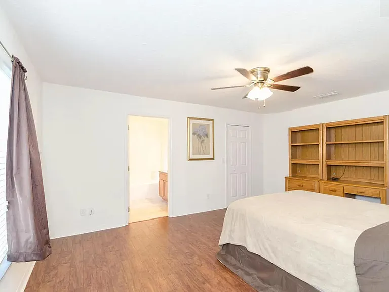Large master bedroom with walk-in closet and private bath