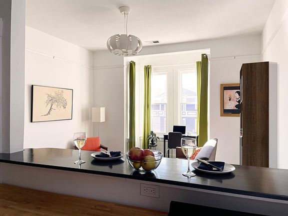 View of living room from kitchen eat-in counter.