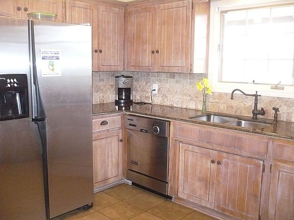 Kitchen with granite and stainless appliances
