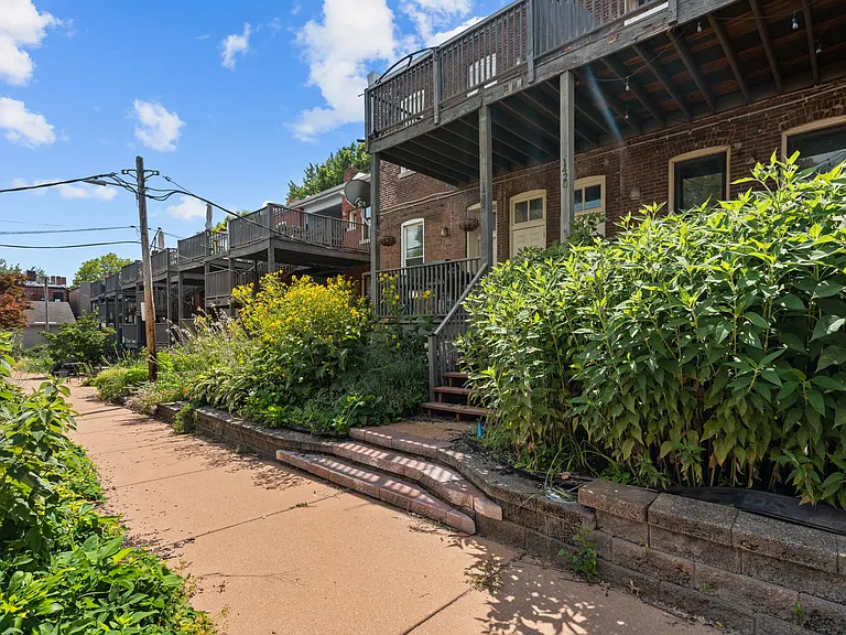 Rear courtyard w/ community garden