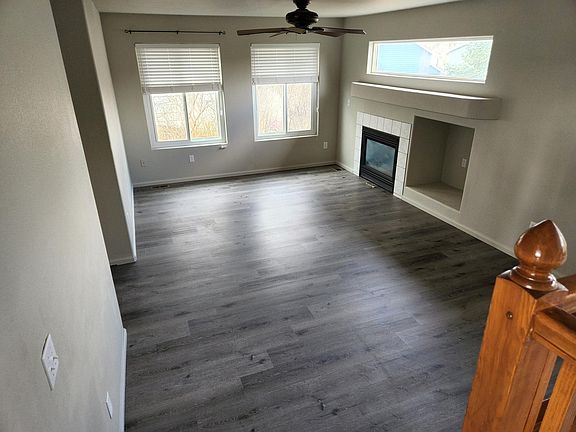 Family room with new floors and blinds
