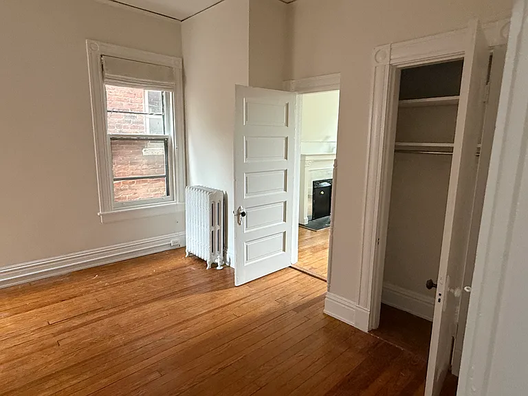 Bedroom 2 with original heart pine floors.