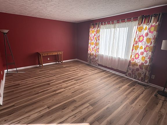 Large Livingroom with lots of natural light from the big picture window.