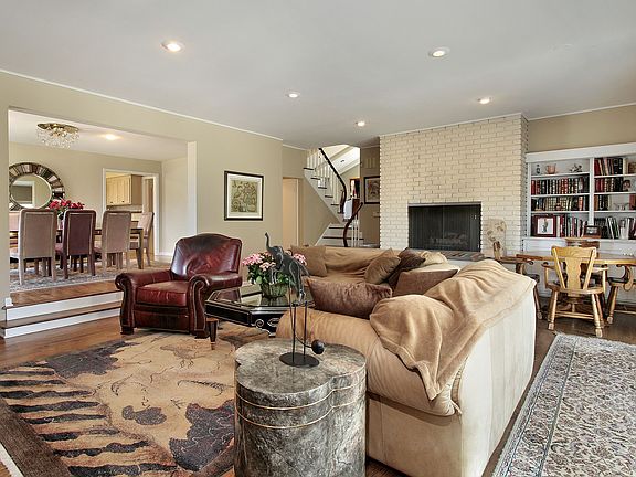 Family room w/gas fireplace opens to DR and patio.