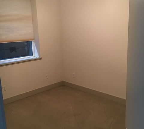 Bedroom 1. Located downstairs, directly behind kitchen.