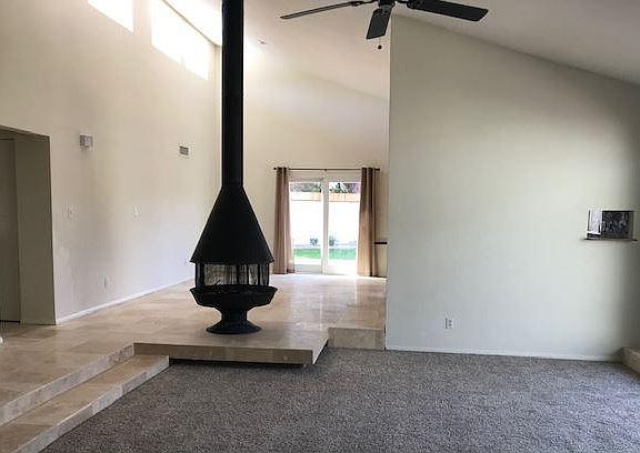 Dual Great Rooms w/ central Fireplace