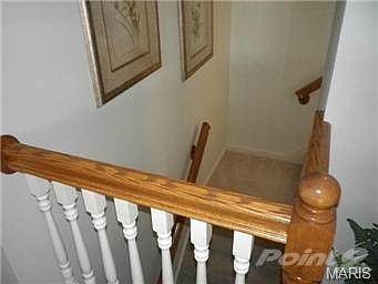 Staircase leading to finished lower level