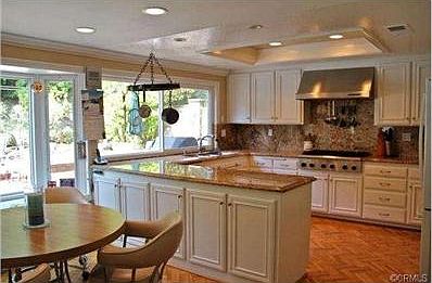 Beautiful, remodeled kitchen has granite counters and recessed l