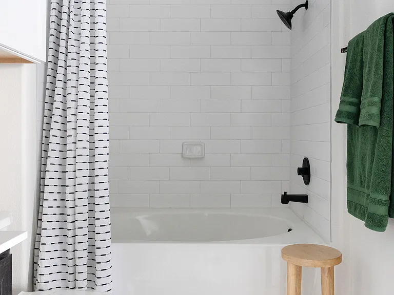 Newly renovated spa-like bathroom with quartz countertops and soaking tubs*