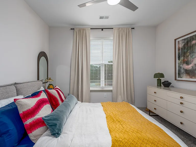 Spacious primary bedroom with natural light and comfortable layout.