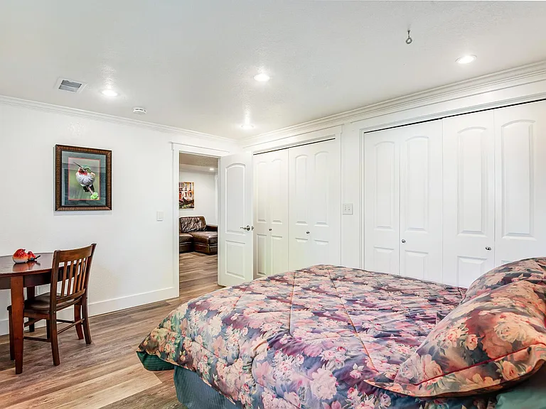 Lower level bedroom with dual closets.