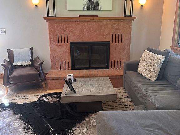 Living room with wood burning fireplace