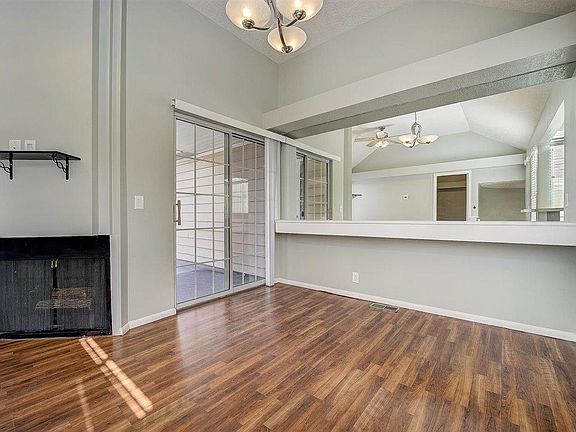 Fireplace, patio door, dining area.