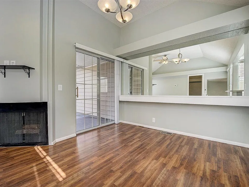 Fireplace, patio door, dining area.