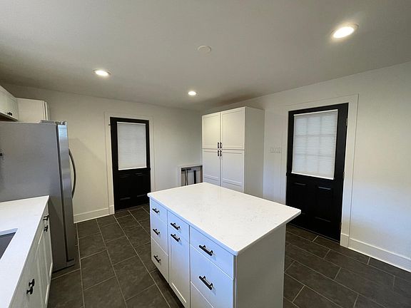Kitchen (Includes gas stove, refrigerator, dish washer and laundry washer and dryer)