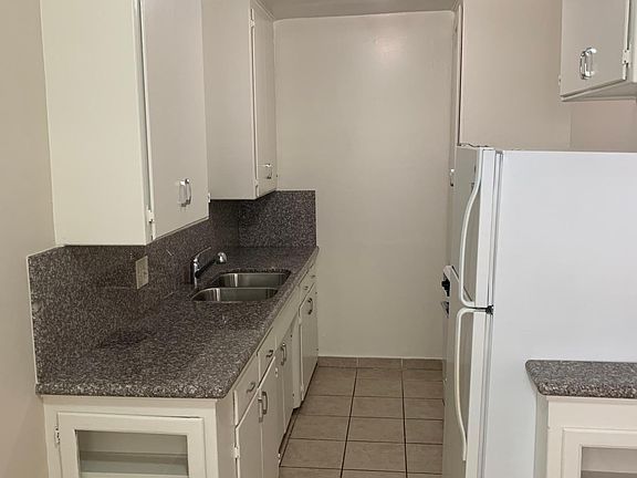 Kitchen with Ample Storage and Granite Counter Tops