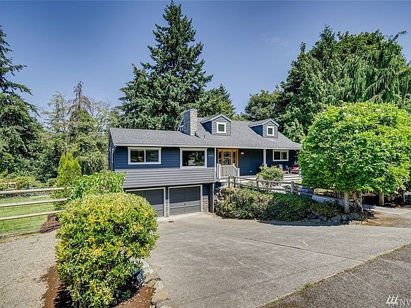 View of home from street. Plenty of garage and off street parking. Large side yard. 