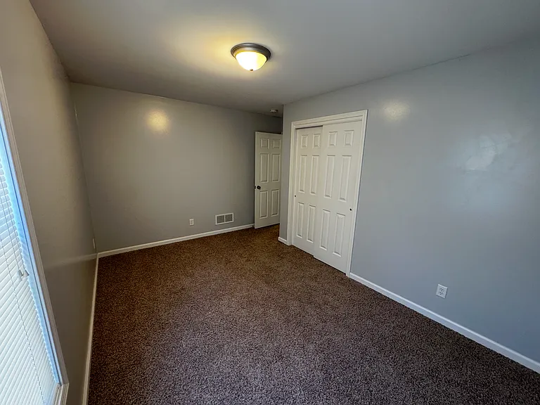 Inside view of the second bedroom located next to the master bedroom. perfect for a nursery. You wont have to go far to attend to your new addition of your family when he or she needs you throughout the night.