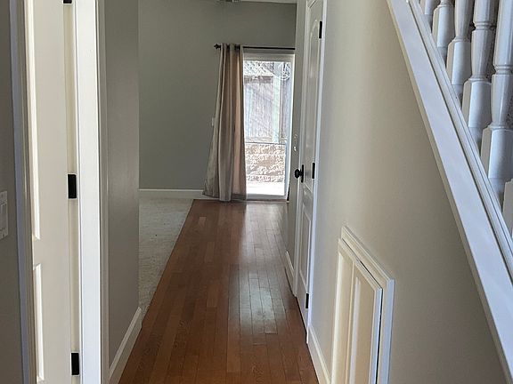 Wood flooring in traffic areas of entry hall