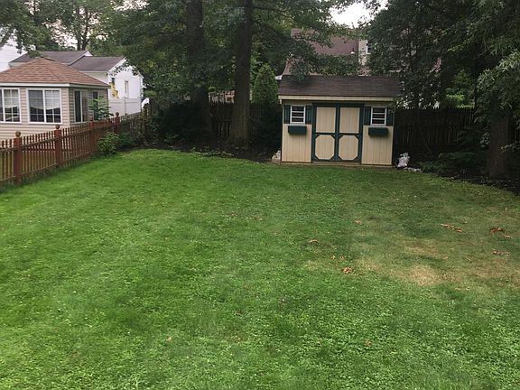 fenced in yard with shed