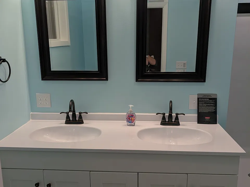 Double vanity with dual outlets