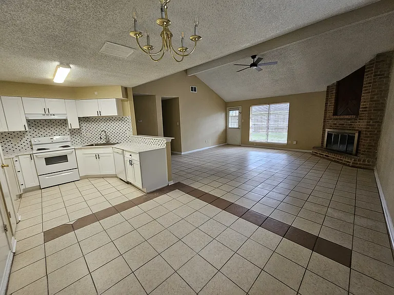 Kitchen and living area, back door and hallway to bedrooms
