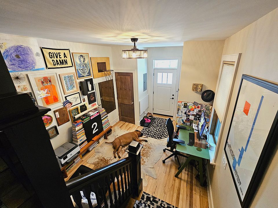 Den view from stairwell (pupper not included with apartment, though yours would be welcome!)
