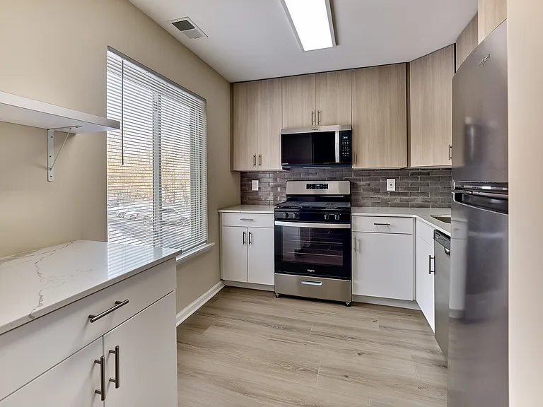 Updated kitchen with stainless steel appliances and modern finishes in this 2 bedroom, 2 bathroom apartment at North Crossing in Willow Grove, PA.