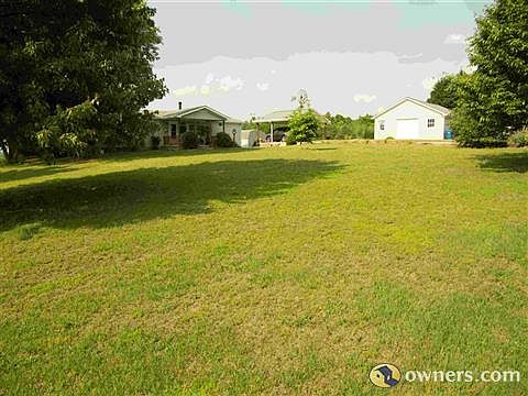 Front yard and shop on right