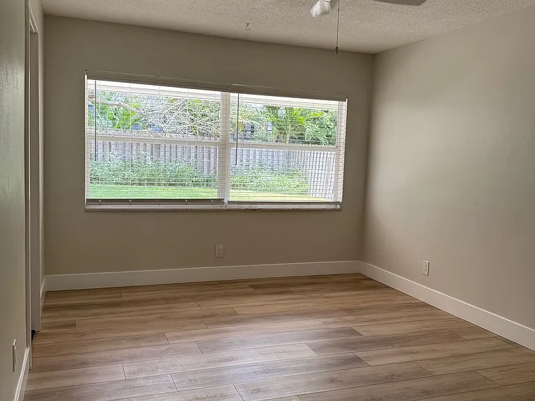 Primary bedroom, window to backyard