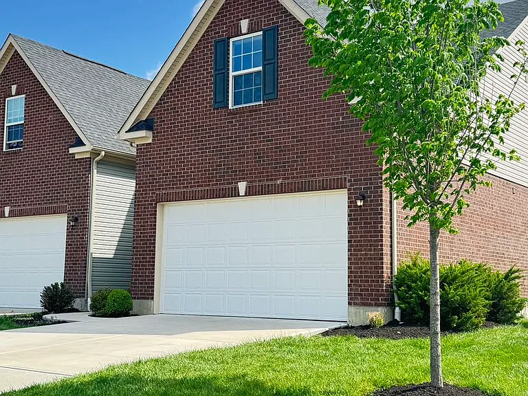 Street view. Attached 2 Car garage, drive way.